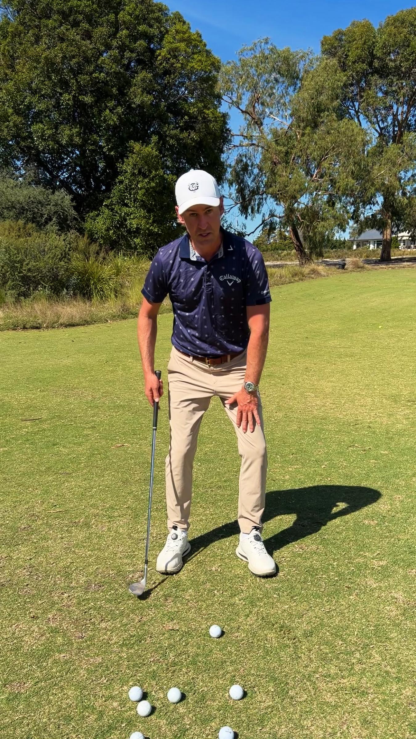Andrew Cooper on the fairway with a wedge